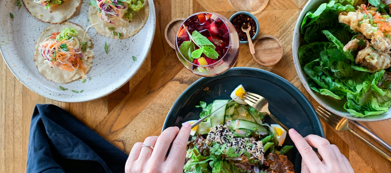 hands eating a delicious meal