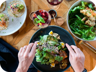 hands eating a delicious meal